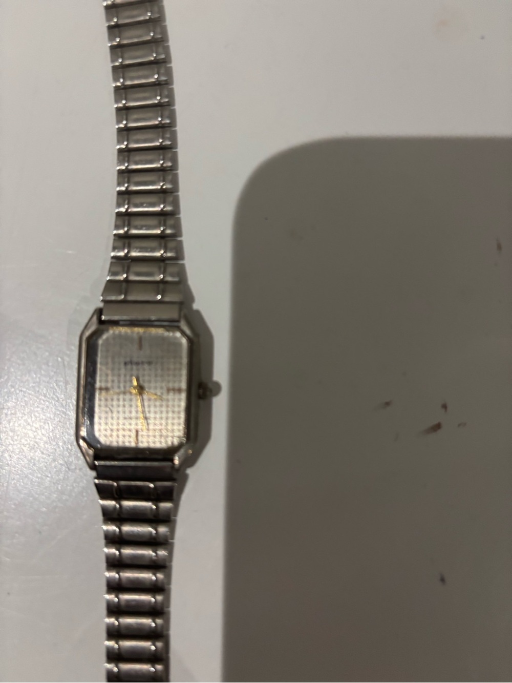 Phasar silver-toned square face wristwatch with gold-toned hands